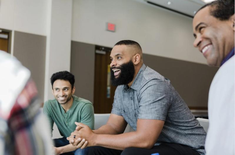 Three men actively engaged participating in a training session
